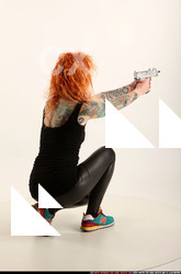 2016 05 ZORA KNEELING AIMING UZI 05 B