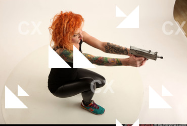 2016 05 ZORA KNEELING AIMING UZI 07 A