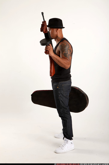 Man Adult Athletic Black Fighting with submachine gun Standing poses Casual