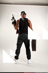 Man Adult Athletic Black Fighting with submachine gun Standing poses Casual
