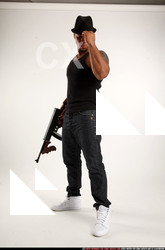 Man Adult Athletic Black Fighting with submachine gun Standing poses Casual