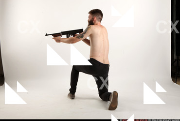 2016 10 OSCAR KNEELING TOMMYGUN SHOOTING 02 B