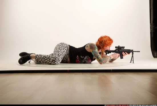 Woman Adult Athletic White Fighting with submachine gun Laying poses Casual