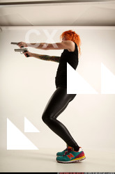 Woman Adult Athletic White Fighting with gun Standing poses Casual