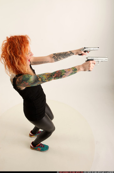 Woman Adult Athletic White Fighting with gun Standing poses Casual
