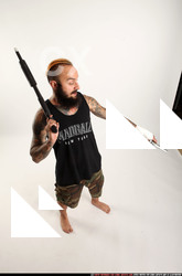 2016 12 EDGAR STANDING AIMING SHOTGUN PISTOL 06 A