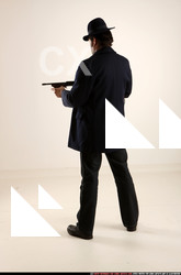 Man Old Average White Fighting with gun Standing poses Coat