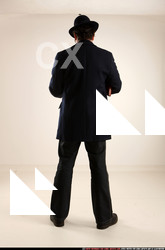 Man Old Average White Fighting with gun Standing poses Coat