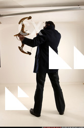Man Old Average White Fighting with bow Standing poses Coat