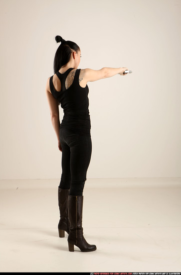 Woman Adult Athletic White Fighting with gun Standing poses Casual