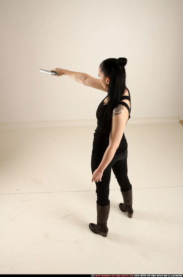 Woman Adult Athletic White Fighting with gun Standing poses Casual