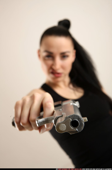 Woman Adult Athletic White Fighting with gun Standing poses Casual