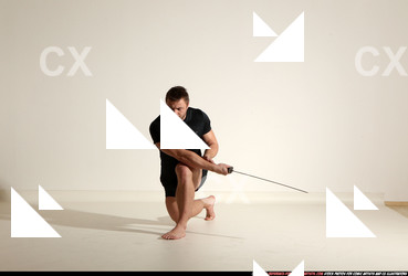 Man Adult Muscular White Fighting with sword Kneeling poses Sportswear