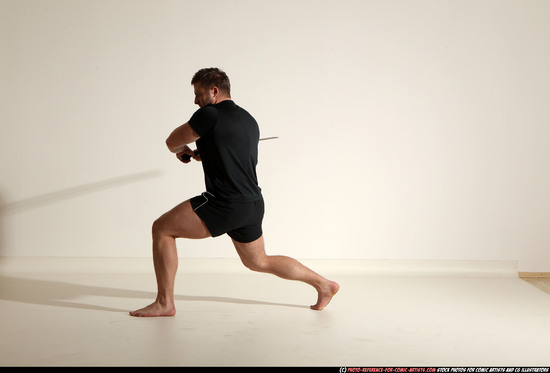 Man Adult Muscular White Fighting with sword Kneeling poses Sportswear