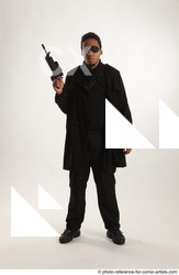 Man Adult Average Black Fighting with gun Standing poses Coat