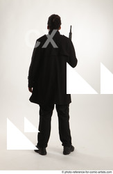 Man Adult Average Black Fighting with gun Standing poses Coat