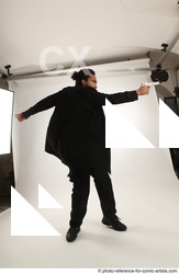 Man Adult Average Black Fighting with gun Standing poses Coat