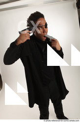 Man Adult Average Black Fighting with gun Standing poses Coat