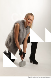 Woman Adult Average White Fighting with hammer Kneeling poses Coat