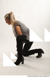 Woman Adult Average White Fighting with hammer Kneeling poses Coat