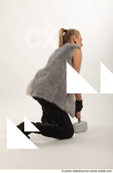 Woman Adult Average White Fighting with hammer Kneeling poses Coat
