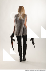 05 2018 01 NIKOL STANDING POSE WITH GUNS