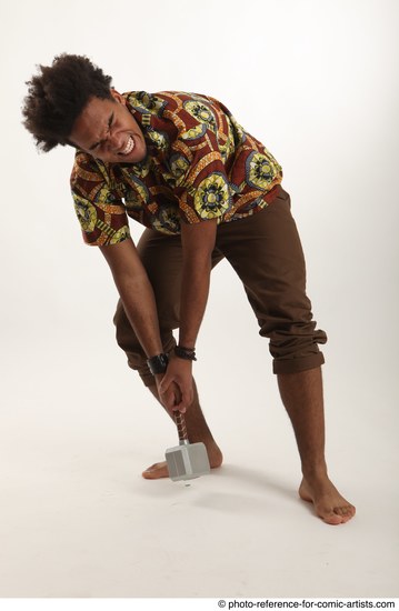 Man Adult Average Black Fighting with hammer Crouching Coat