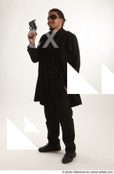Man Adult Average Black Fighting with gun Standing poses Coat