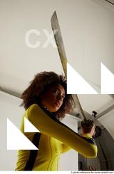Woman Adult Average Black Fighting with sword Standing poses Casual