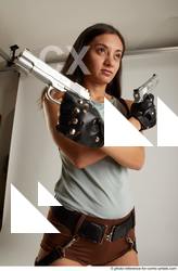 Woman Adult Average Fighting with gun Standing poses Casual Latino