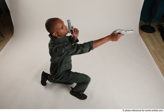 Man Adult Average Black Fighting with gun Kneeling poses Casual