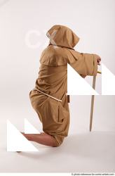 06 2018 01 JOEL ADAMSON MONK KNEELING POSE WITH SWORD