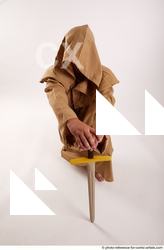 09 2018 01 JOEL ADAMSON MONK KNEELING POSE WITH SWORD