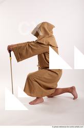 03 2018 01 JOEL ADAMSON MONK KNEELING POSE WITH SWORD