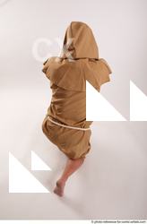 13 2018 01 JOEL ADAMSON MONK KNEELING POSE WITH SWORD