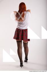 05 2018 01 TINA STANDING POSE WITH TWO GUNS