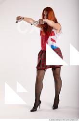 02 2018 01 TINA STANDING POSE WITH TWO GUNS