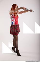Woman Adult Average White Fighting with gun Standing poses Casual