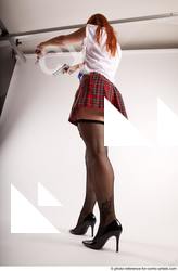 12 2018 01 TINA STANDING POSE WITH TWO GUNS