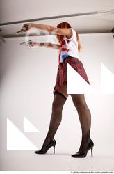 11 2018 01 TINA STANDING POSE WITH TWO GUNS