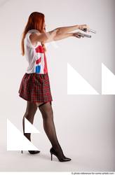 07 2018 01 TINA STANDING POSE WITH TWO GUNS