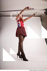 16 2018 01 TINA STANDING POSE WITH TWO GUNS
