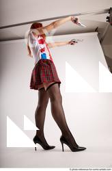 Woman Adult Average White Fighting with gun Standing poses Casual