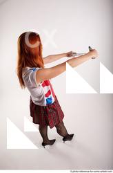 25 2018 01 TINA STANDING POSE WITH TWO GUNS