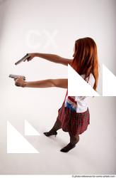 22 2018 01 TINA STANDING POSE WITH TWO GUNS