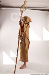 11 2019 01 JOEL ADAMSON MONK STANDING POSE WITH A…