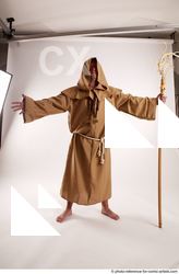 09 2019 01 JOEL ADAMSON MONK STANDING POSE WITH A…