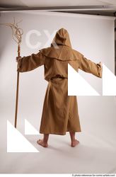 13 2019 01 JOEL ADAMSON MONK STANDING POSE WITH A…