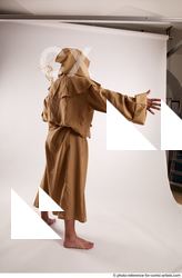 14 2019 01 JOEL ADAMSON MONK STANDING POSE WITH A…