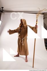 10 2019 01 JOEL ADAMSON MONK STANDING POSE WITH A…